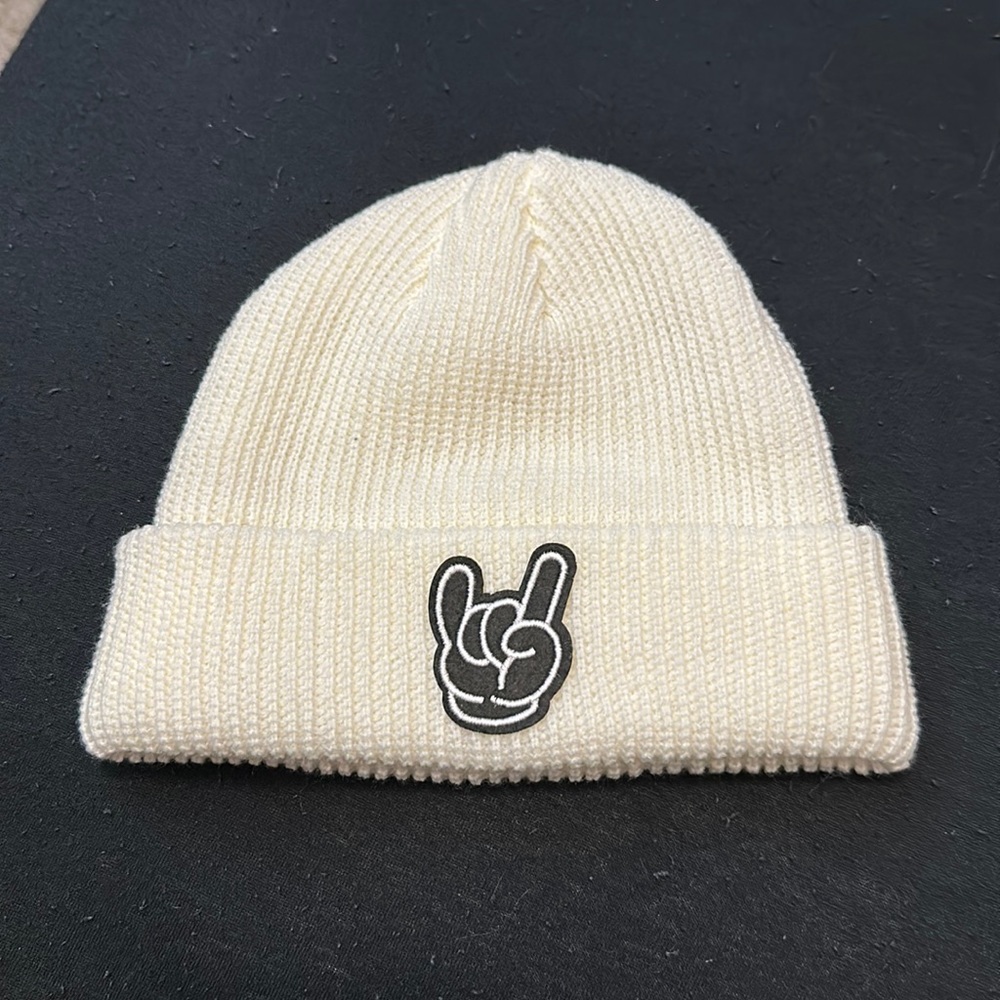 White beanie with a 🤘 on it!